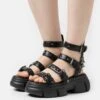 KOI FOOTWEAR Raining Vengeance Charm Platform - Platform Sandals